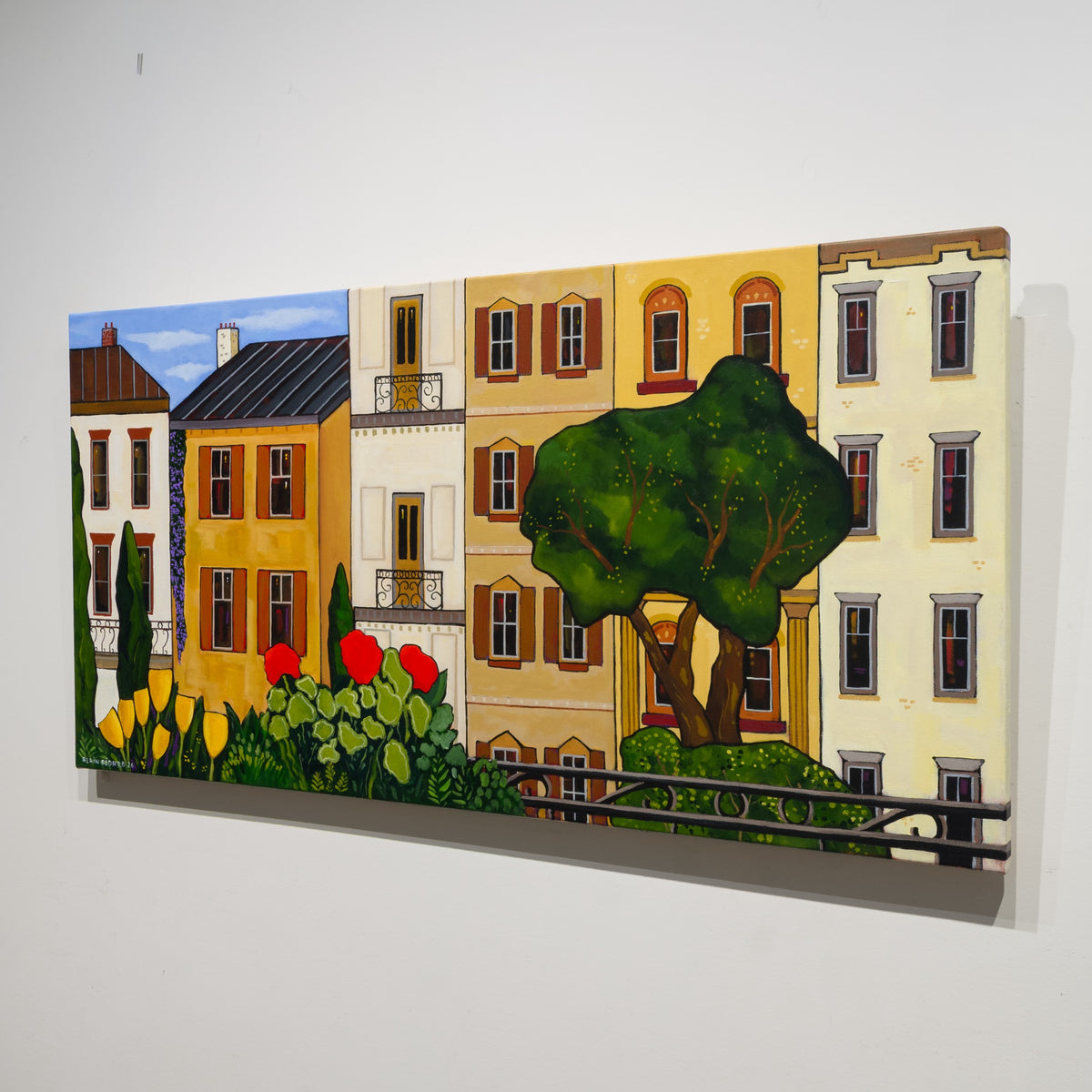 Angled gallery view of Fleurs du balcon by Alain Bédard, showing the unframed canvas in profile and the flower-filled architectural composition.