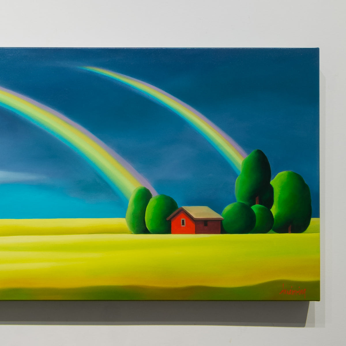 Detail of Dana Irving’s Double Rainbow showing twin rainbow arcs above a red outbuilding and rounded green trees.