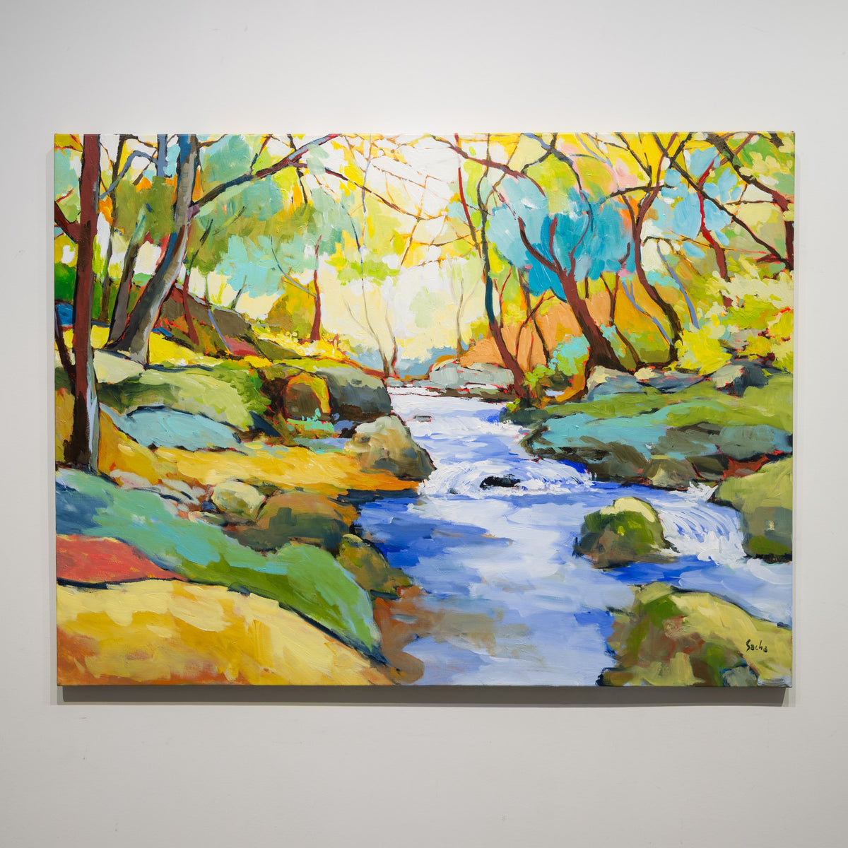 Printemps Dans Le Sous-Bois by Sacha Barrette, 36 × 48 inch acrylic on canvas showing a blue stream flowing between rocks and brightly coloured woodland.