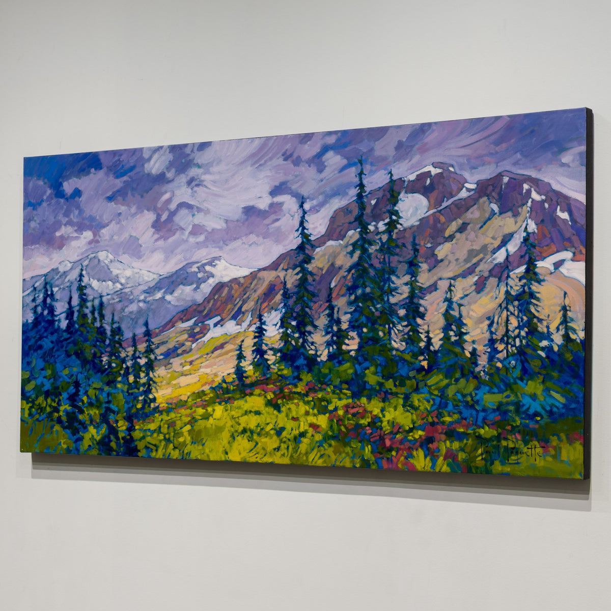 Angled view of Paul Paquette’s Alpine Meadows showing the wide unframed canvas and finished black edge.