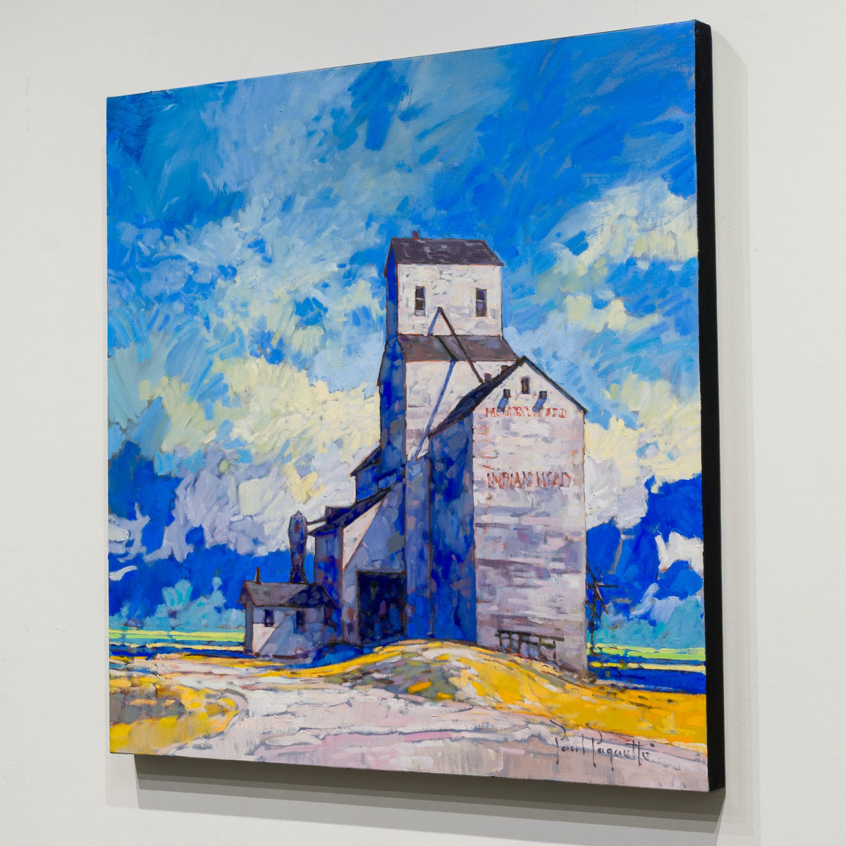Angled view of Paul Paquette’s Prairie Giant showing the unframed canvas and finished black edge.