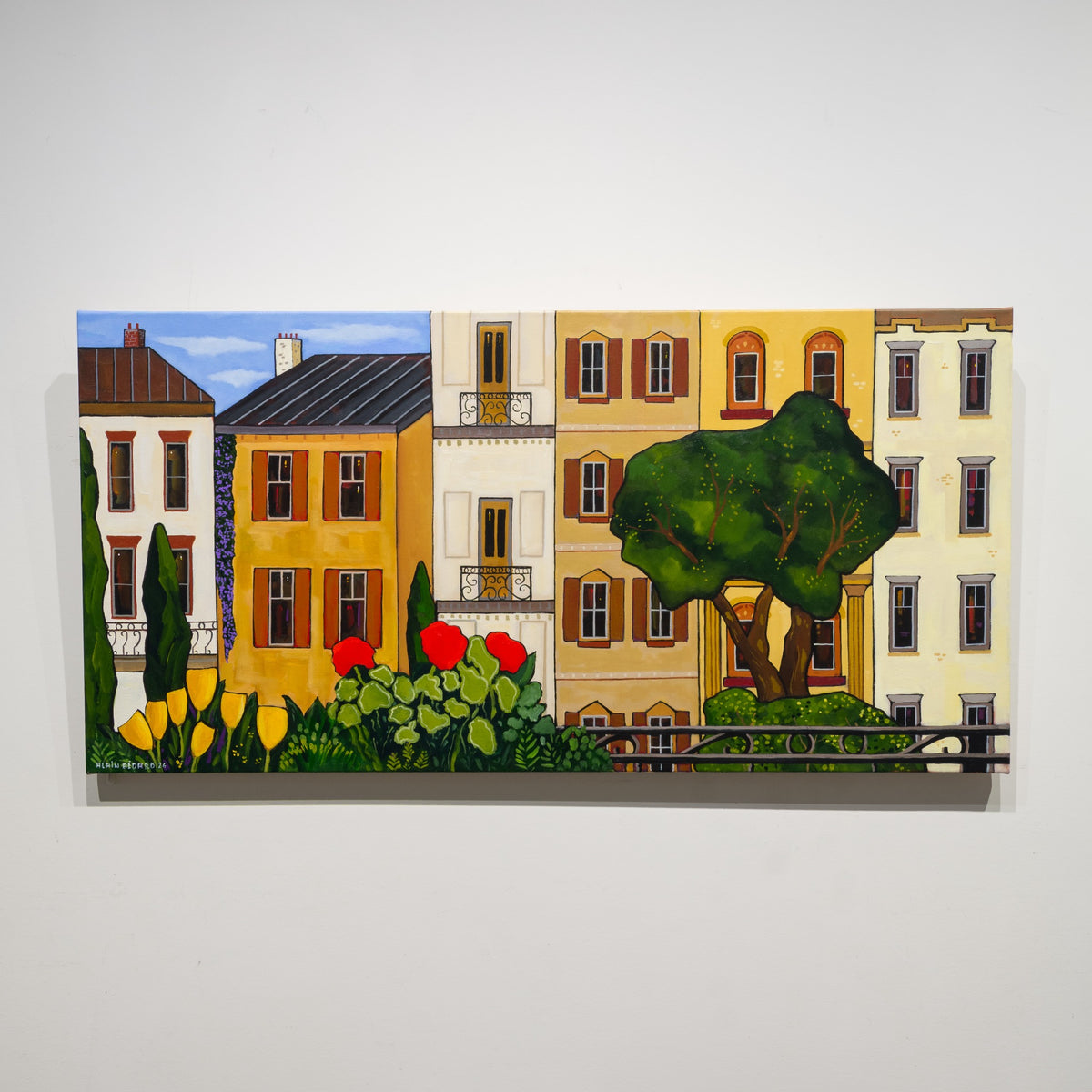 Fleurs du balcon by Alain Bédard, 20 × 40 inch acrylic on canvas showing red and yellow balcony flowers before warm-toned façades and a broad green tree.