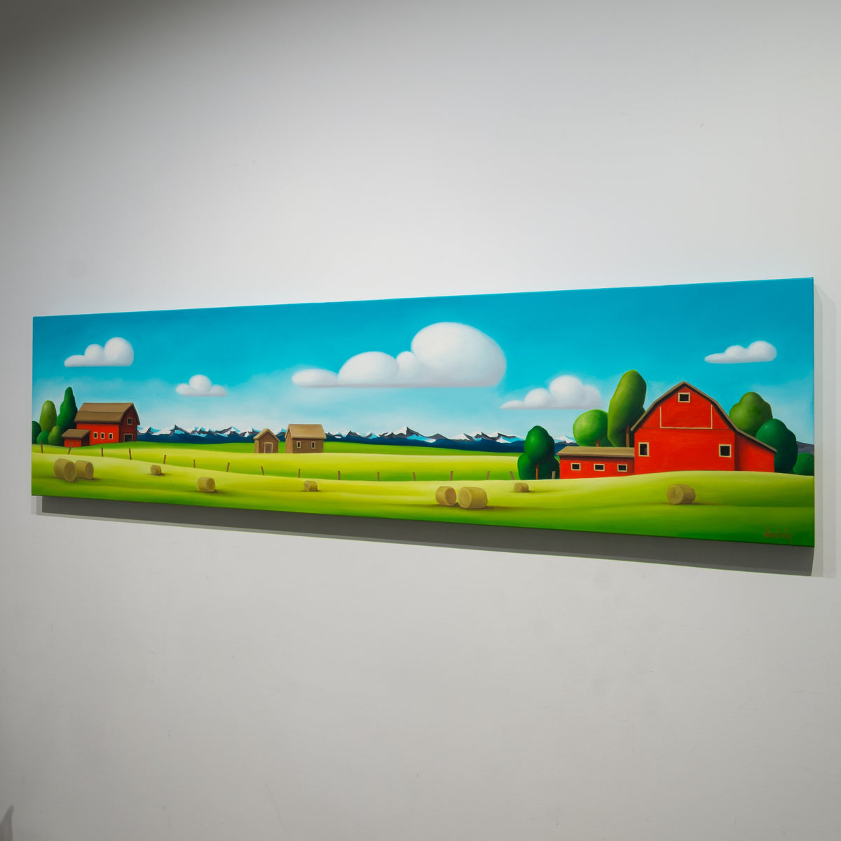Angled view of Dana Irving’s Red Barns: Cowboy Clouds showing the 1½ inch image-wrapped gallery canvas.