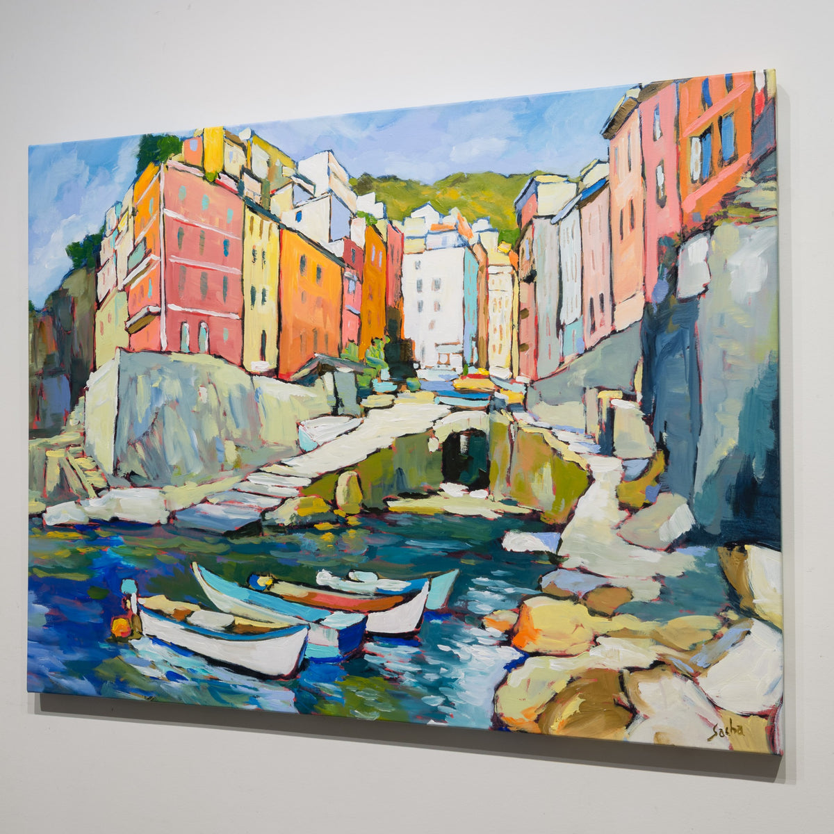 Angled gallery view of Sacha Barrette’s Riomaggiore Cinque Terre Italia showing the coastal composition across the painted canvas surface.