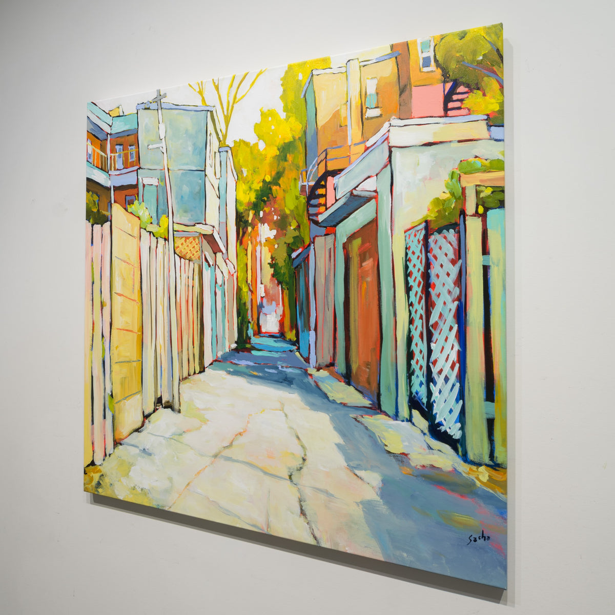 Angled gallery view of Sacha Barrette’s Ruelle Pastels et Colours Fauvers showing the square unframed canvas and painted image continuing around the stretcher edge.